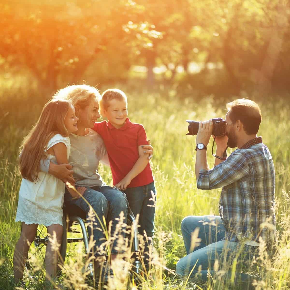 A photographer taking a photo of a family.